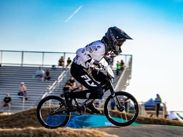 Liam mid-race on a BMX track