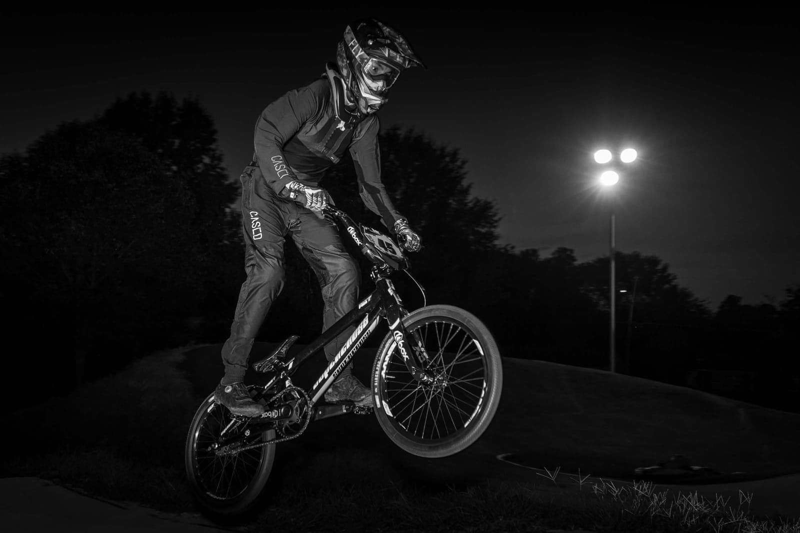 Manual on a BMX bike at night