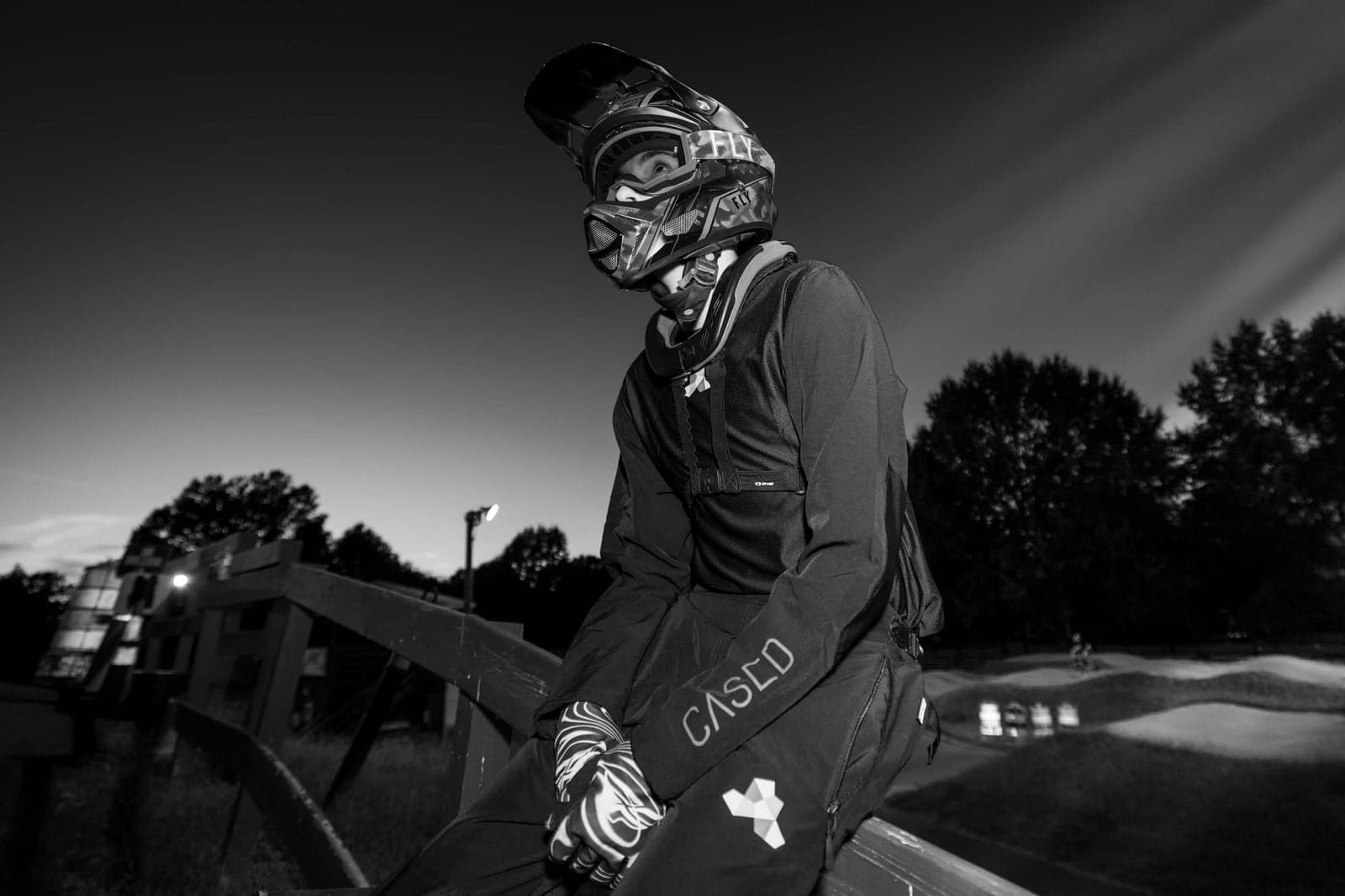 Liam at dusk in full race gear on the track